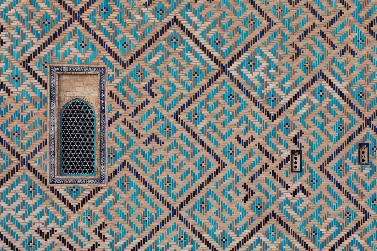 ancient wall of a mosque of mosaic tiles-adobe
